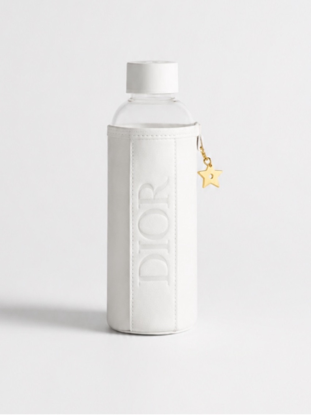 Authentic Dior Bottle w/ White Sleeve & Gold Star Charm. New. Comes With Box.